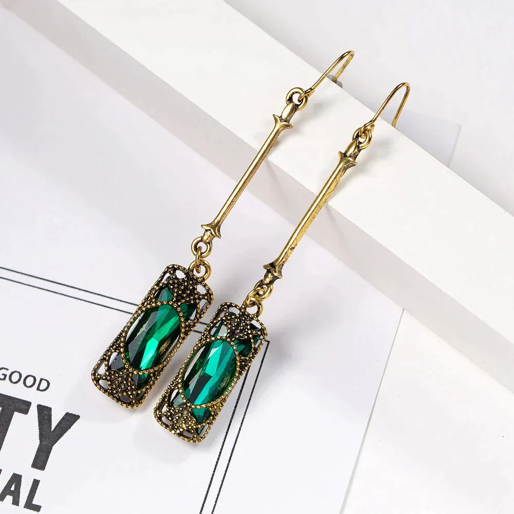 Elena | Golden earrings with green lantern pendant