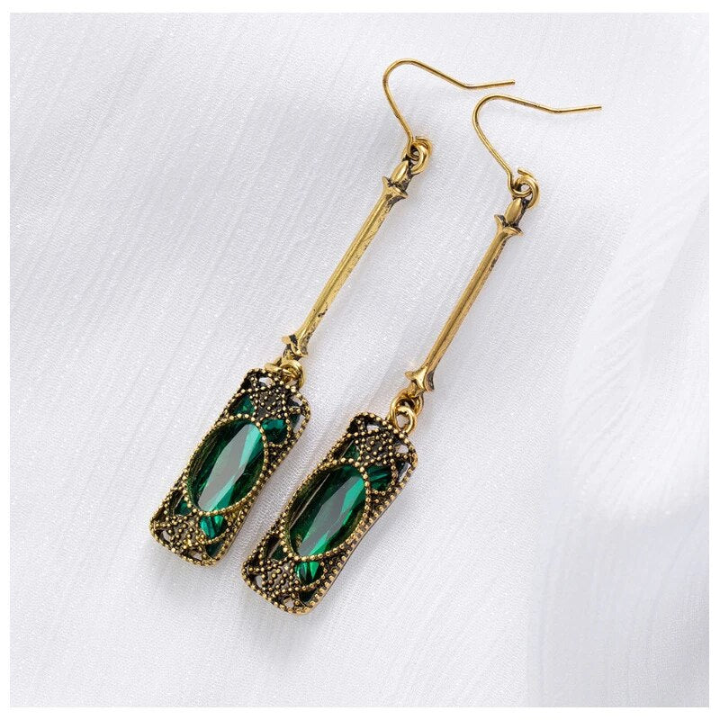 Elena | Golden earrings with green lantern pendant