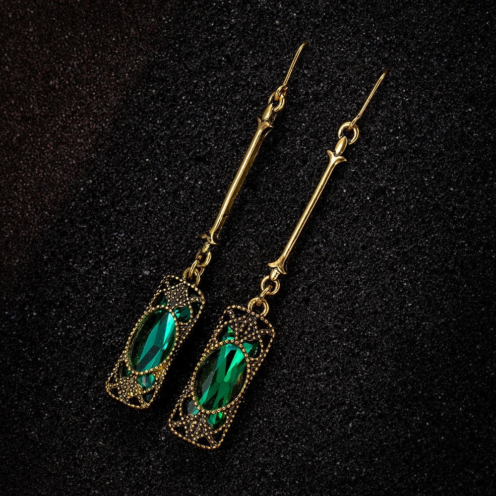 Elena | Golden earrings with green lantern pendant