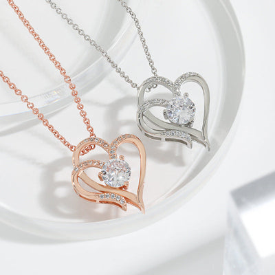 Elena | Necklace with a charming double heart and sparkling zircons.