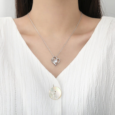 Elena | Necklace with a charming double heart and sparkling zircons.