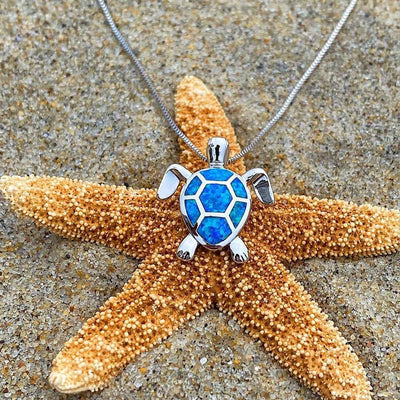 Da Ana | Elegant NAIAE necklace and earring set with a delicate opal sea turtle in silver.