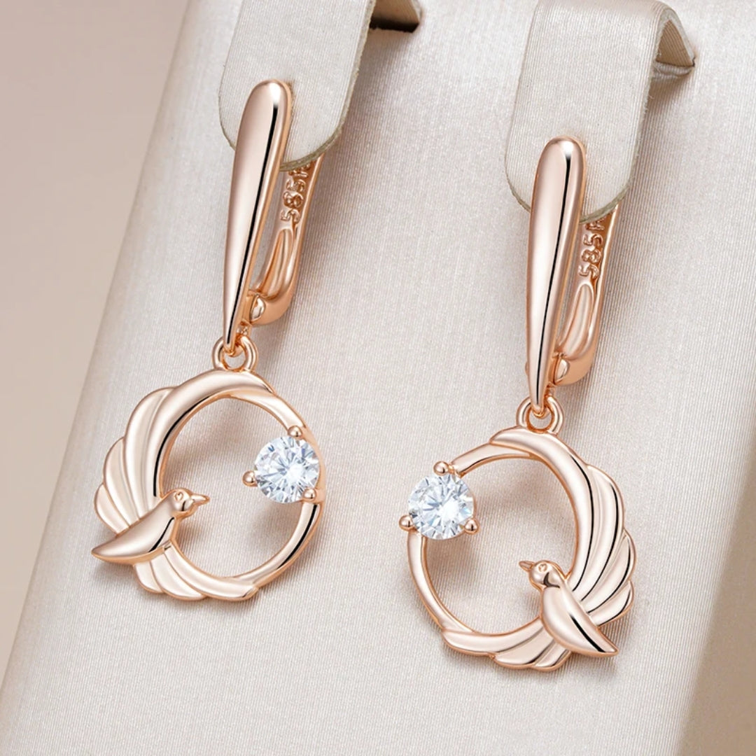 Raquel | Radiant gold-plated earrings with elegant bird motifs