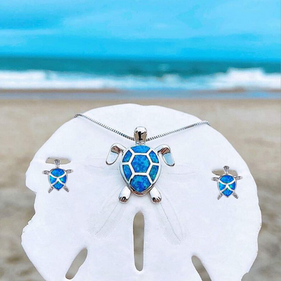 Da Ana | Elegant NAIAE necklace and earring set with a delicate opal sea turtle in silver.