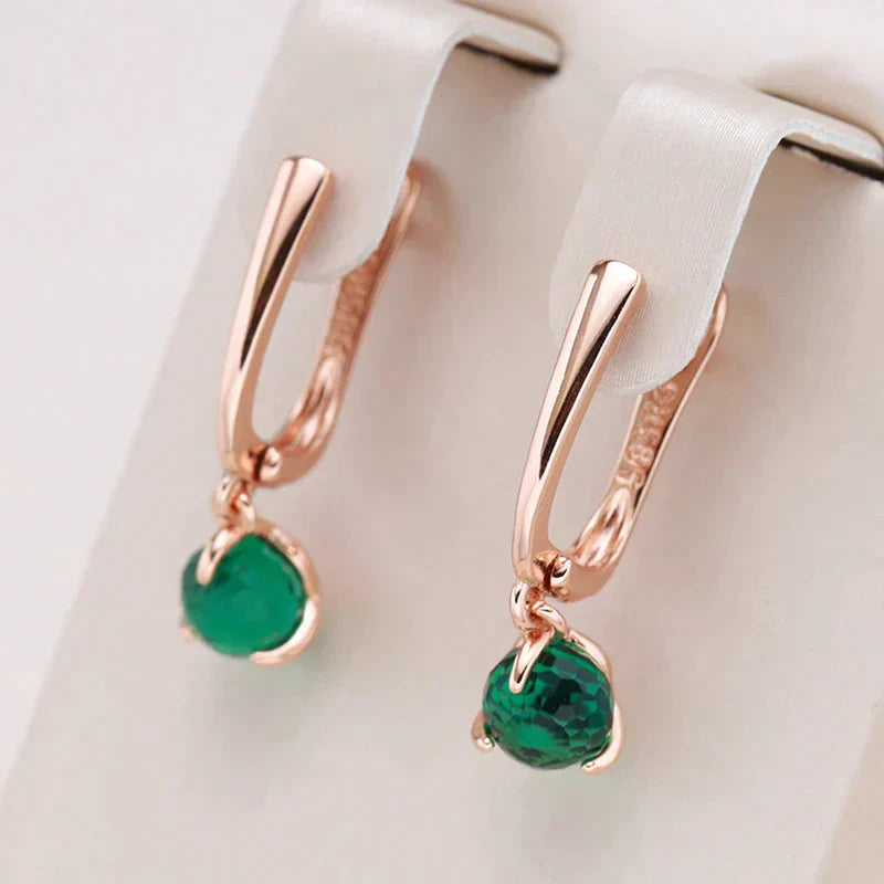 Pink | Elegant gold earrings with sparkling green crystals