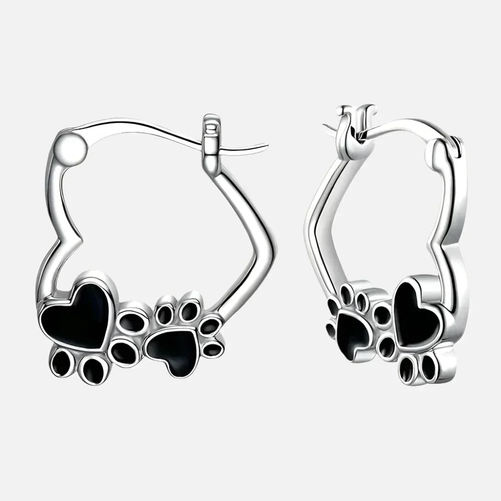 Olga | Silver-effect paw heart hoop earrings with black enamel.