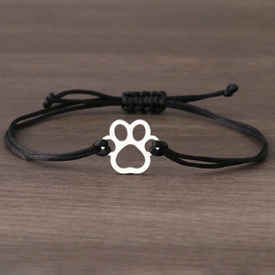 Emma | ELINE – Elegant adjustable paw-shaped bracelet with black and red cord.