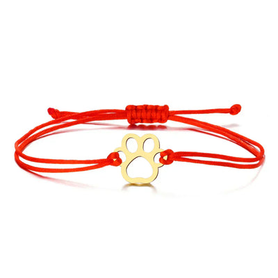 Emma | ELINE – Elegant adjustable paw-shaped bracelet with black and red cord.