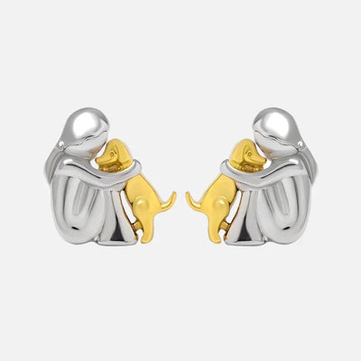 Paola | Hug earrings in silver and gold.
