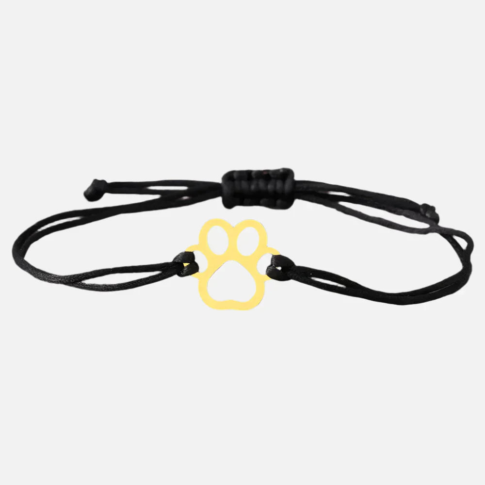 Emma | ELINE – Elegant adjustable paw-shaped bracelet with black and red cord.