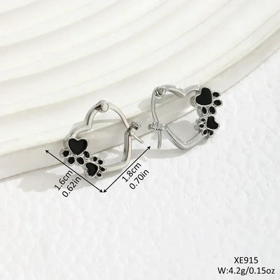 Olga | Silver-effect paw heart hoop earrings with black enamel.