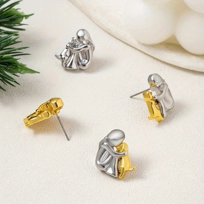 Paola | Hug earrings made of silver & gold for a stylish look