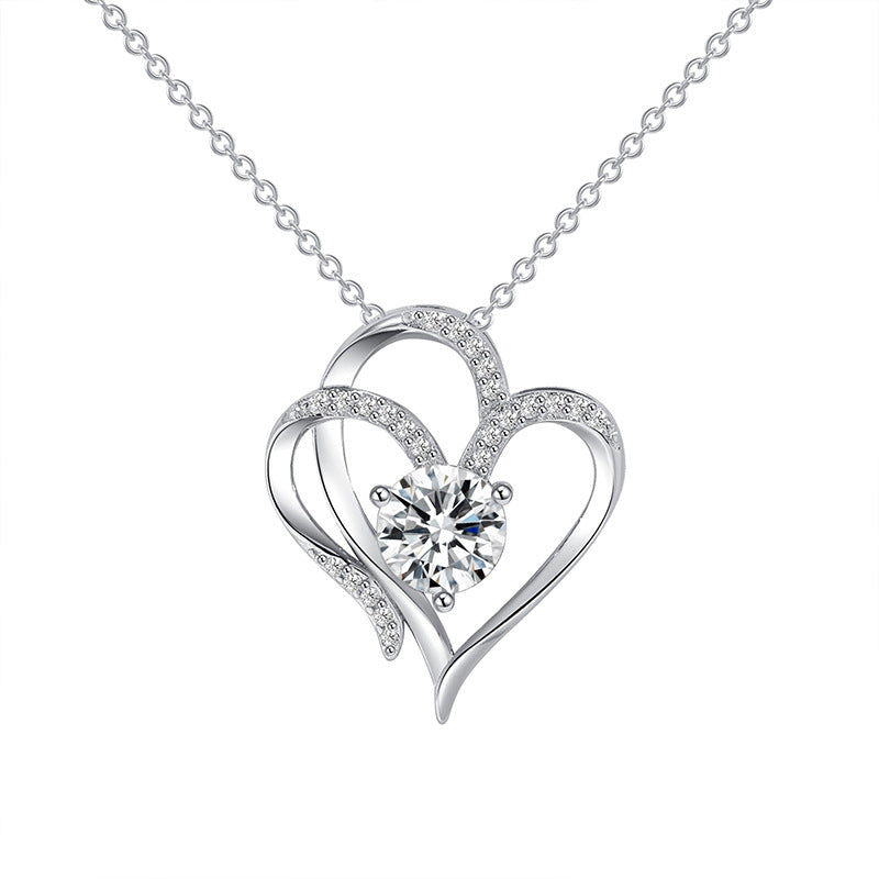 Elena | Necklace with a charming double heart and sparkling zircons.