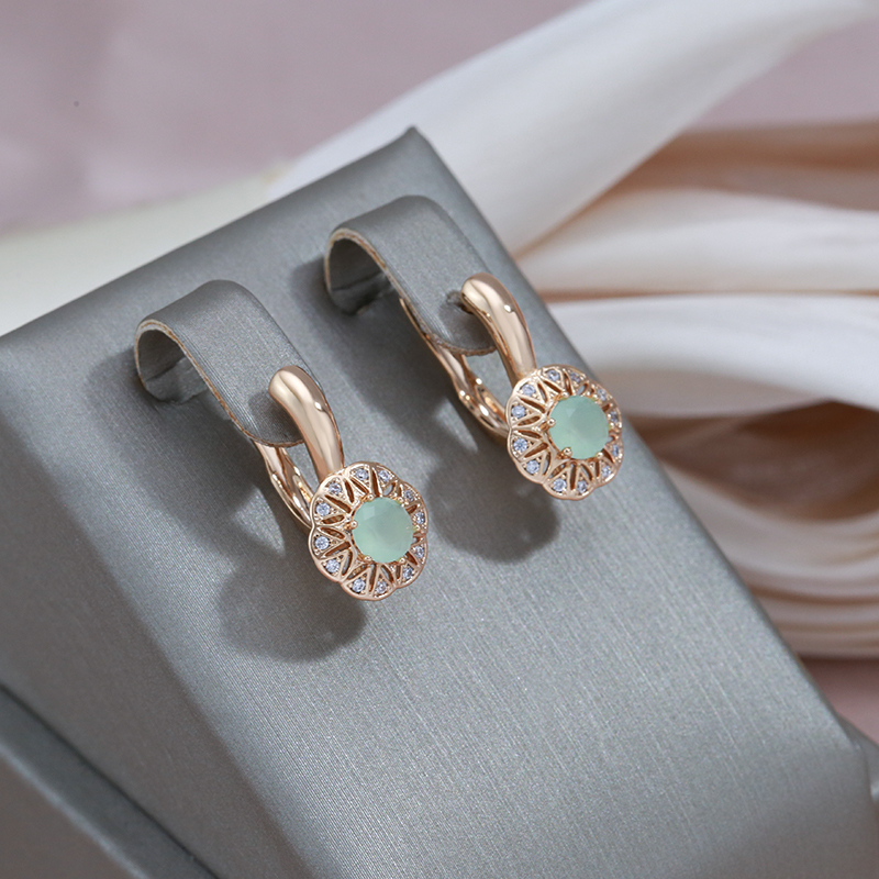 Gabriela | Exquisite gold earrings with sparkling zirconia and green accent