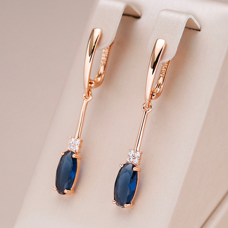 Teresa | Glamorous gold earrings with sparkling blue crystals