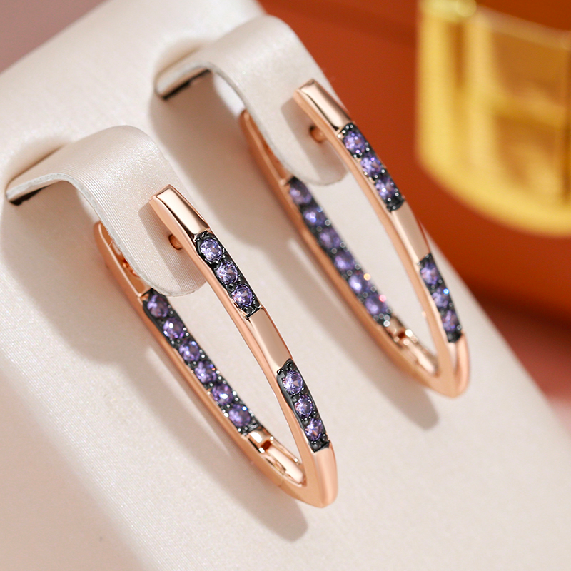 Valentina | Glamorous gold earrings with radiant purple zircons