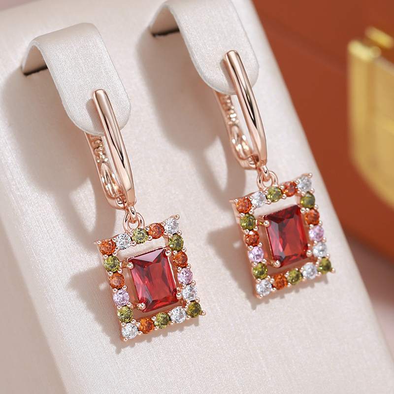 Camila | Elegant gold earrings with sparkling red cubic crystals
