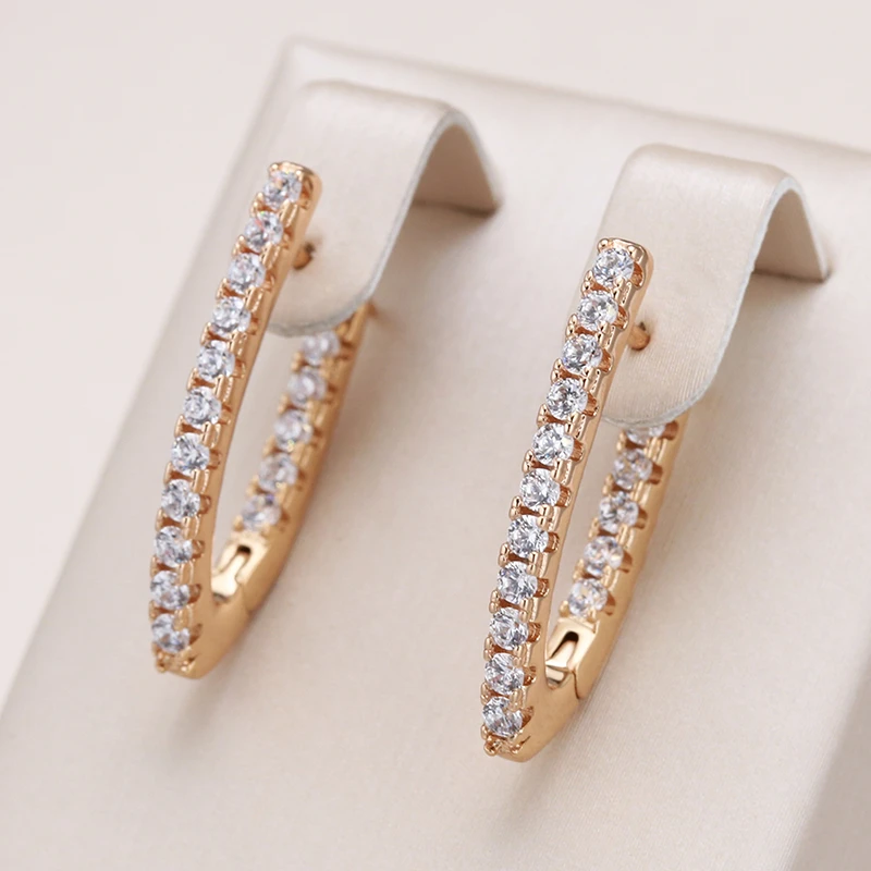 Lorena | Stylish gold earrings with elegant radiant effects