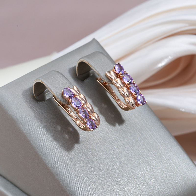 Paula | Captivating golden stud earrings with sparkling purple zirconias