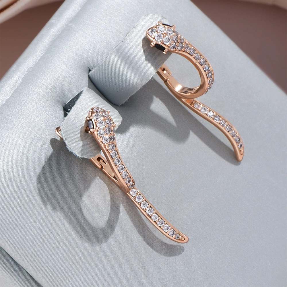 Elisa | Elegant, sparkly snake earrings for a glamorous finish.