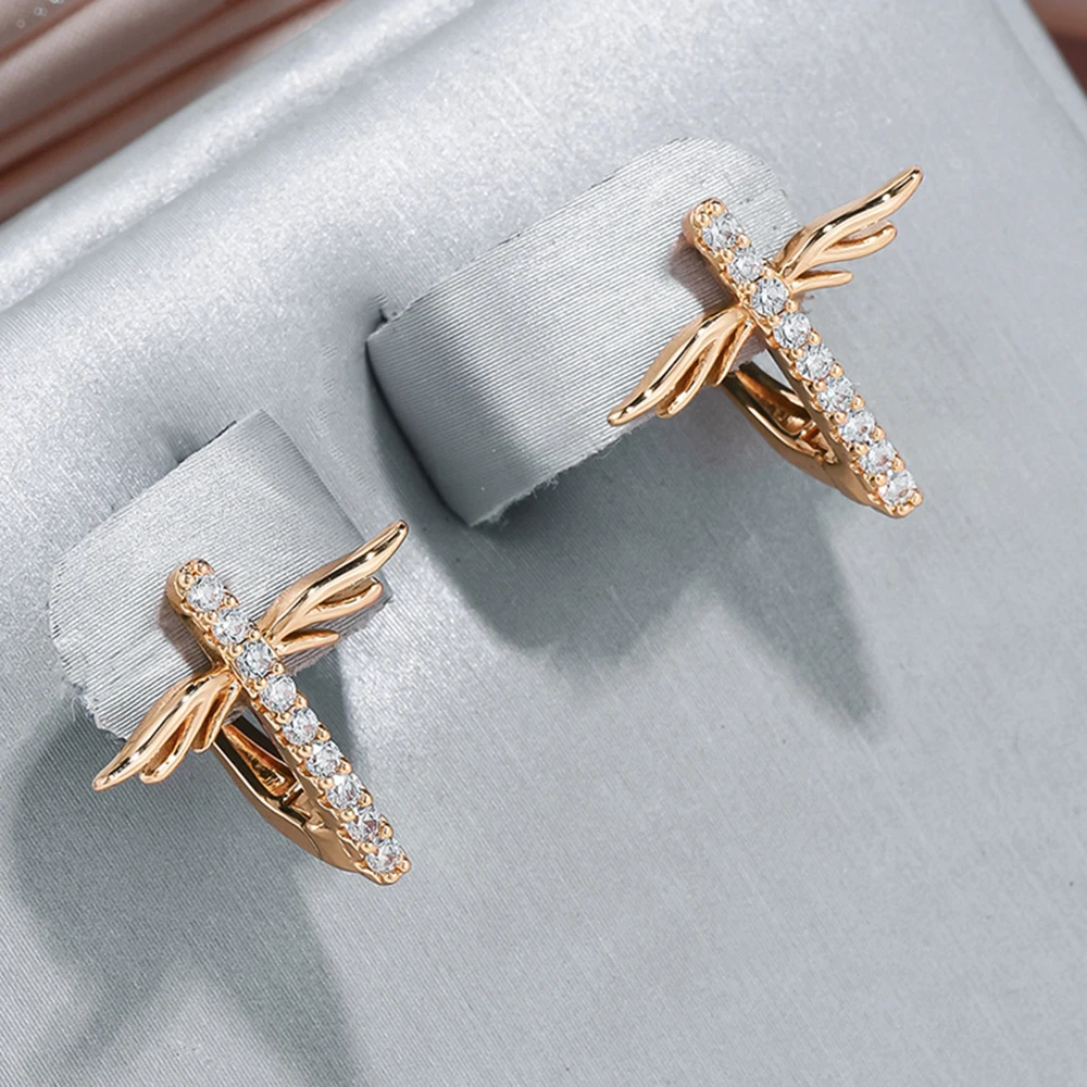 Romina | Elegant gold dragonfly earrings for a touch of elegance.