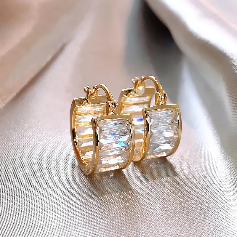 Jenn | Fascinating radiant white crystal earrings in noble gold